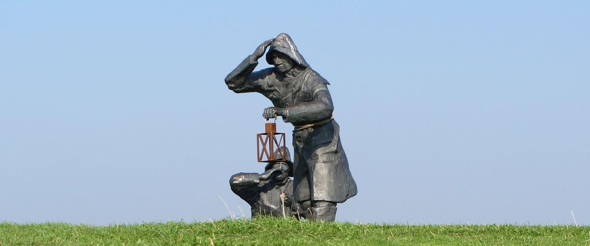 Amelander dijkwachters | CC-BY.SA.3.0, Ytzen, Wikimedia (Sculptures in Ameland)